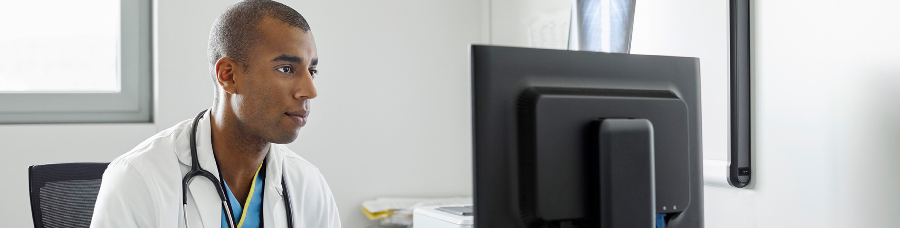 Healthcare professional intently watching something